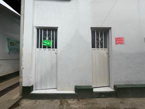 A white building with two doors

AI-generated content may be incorrect.